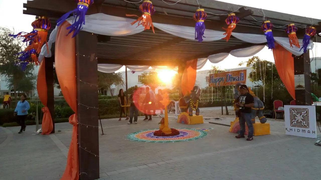 Sunset event pavilion with patterned floor décor and suspended ornaments.
