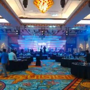 Healthcare-sector conference stage in a large event hall