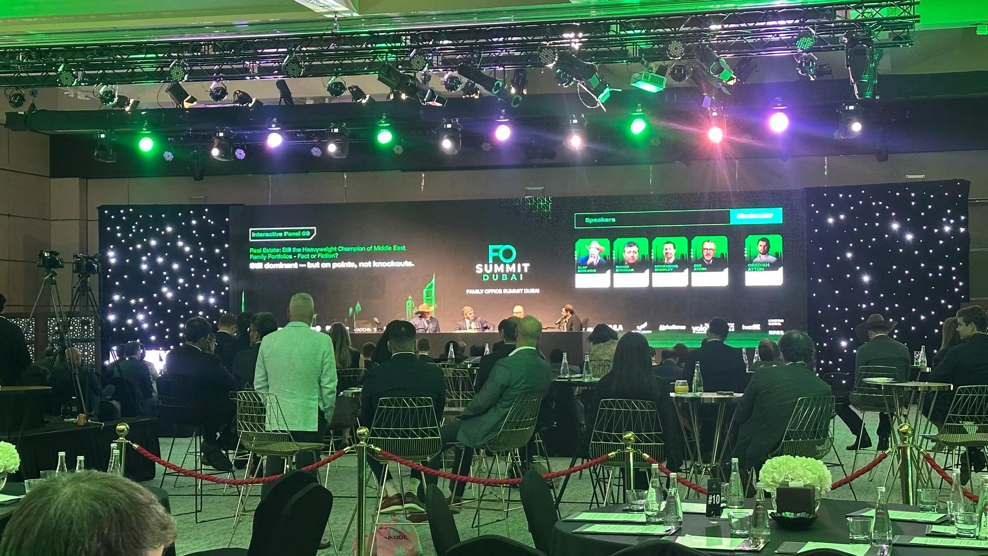 Delegates gathered before a wide international summit stage